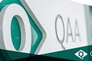 A photograph from an angle of the logo of the QAA, a quality assurance agency in the UK