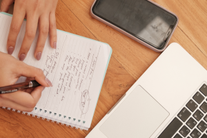 woman writing in a notebook