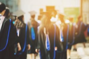 students in graduation cloaks and hats